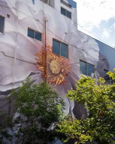 Building with a flower mural on the side